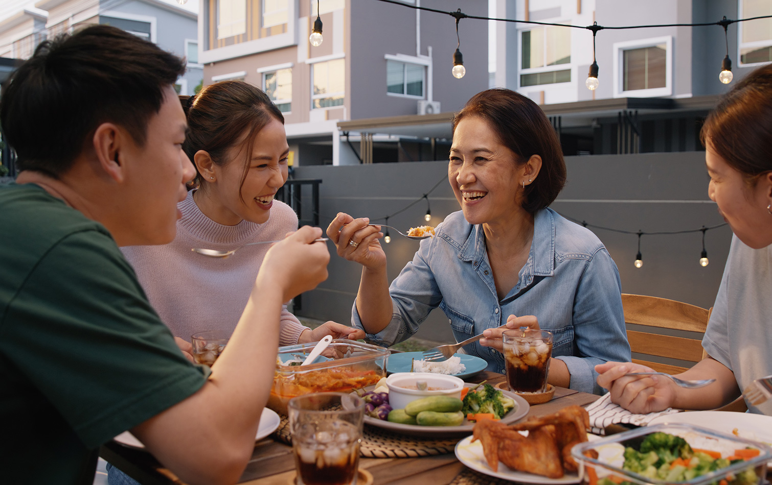 Family eating a meal at the Chef's kitchen and communal Lounge
